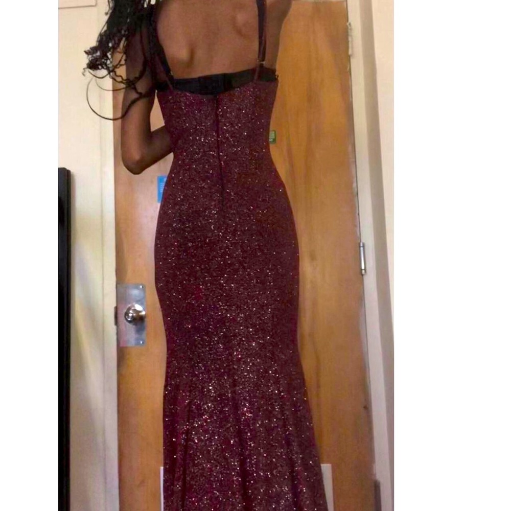 This is a burgundy maxi dress with a V line and short sleeves.